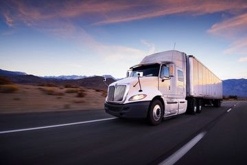 Dry van semi truck on the highway